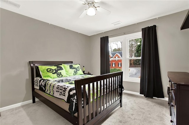 carpeted bedroom with ceiling fan