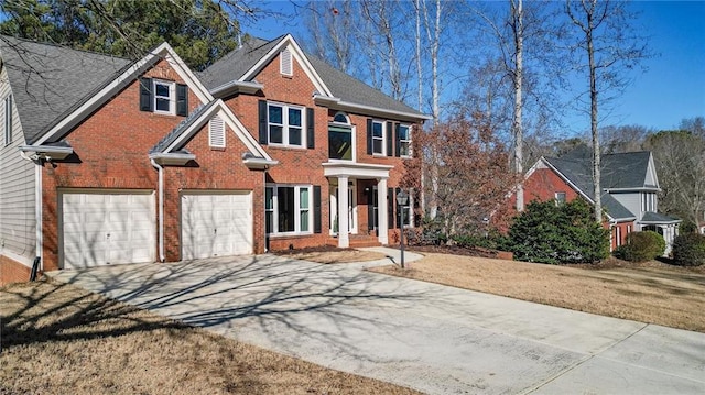 view of front facade featuring a garage and a front lawn