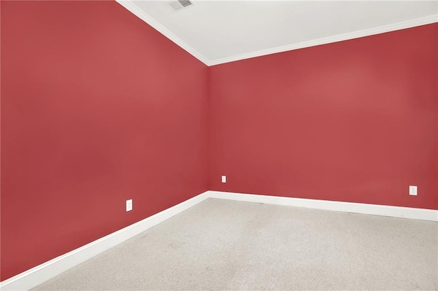 empty room with crown molding and carpet floors