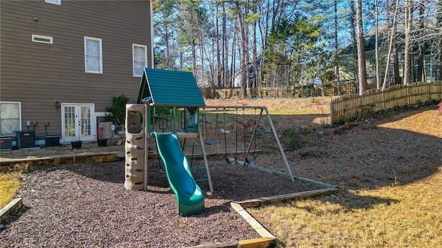 view of play area with french doors and central air condition unit