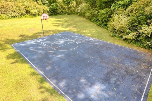 view of basketball court featuring a lawn