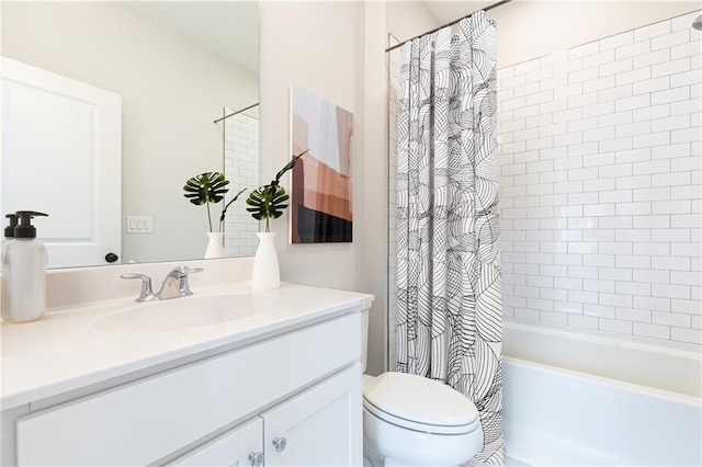 full bath with vanity, toilet, and shower / bath combo