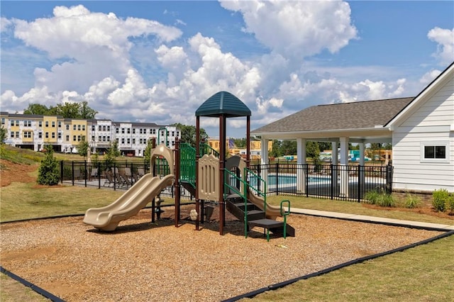 community jungle gym featuring fence