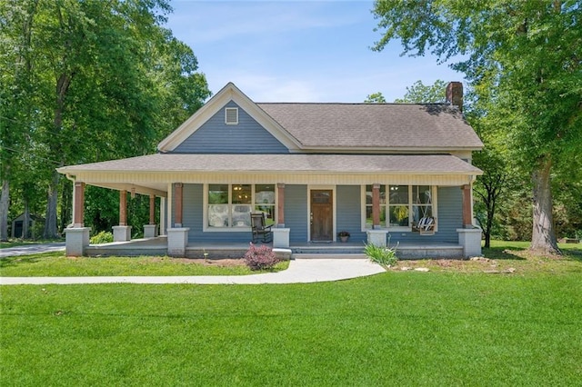 1382 6th Ave, Auburn, GA 30011 - view of front facade featuring a porch, a front lawn, a chimney, and a shingled roof