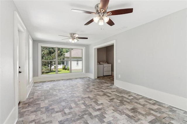 1382 6th Ave, Auburn, GA 30011 - empty room featuring washing machine and clothes dryer, ceiling fan, and baseboards