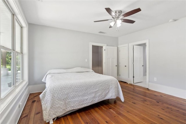1382 6th Ave, Auburn, GA 30011 - bedroom featuring wood-type flooring, a ceiling fan, and baseboards