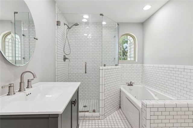 1382 6th Ave, Auburn, GA 30011 - bathroom featuring a jetted tub, a stall shower, vanity, and tile patterned floors