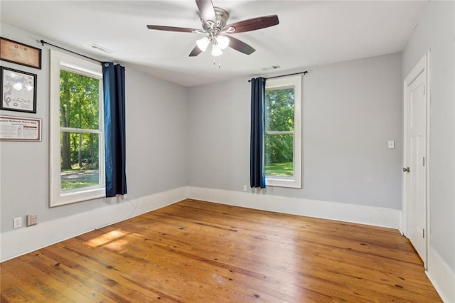 1382 6th Ave, Auburn, GA 30011 - empty room featuring wood-type flooring, ceiling fan, and baseboards