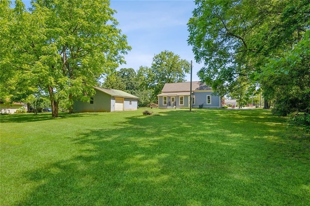 1382 6th Ave, Auburn, GA 30011 - view of grassy yard featuring a garage