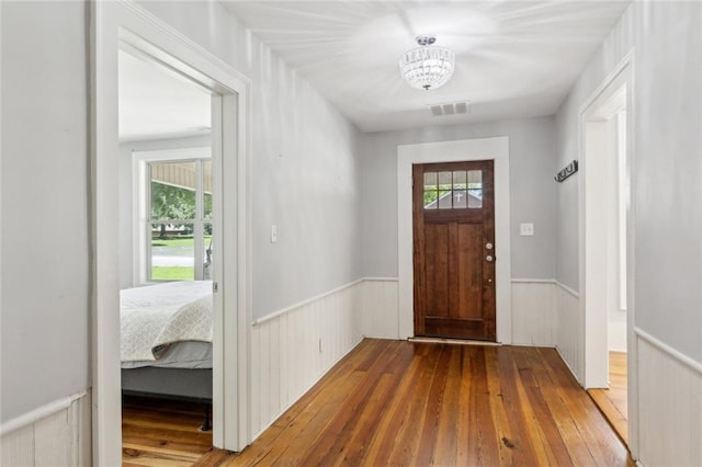 1382 6th Ave, Auburn, GA 30011 - entryway featuring wainscoting, wood-type flooring, and a chandelier