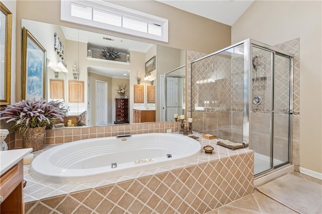 11715 Dancliff Trce, Alpharetta, GA 30009 - bathroom with vanity, a shower stall, a garden tub, and tile patterned flooring