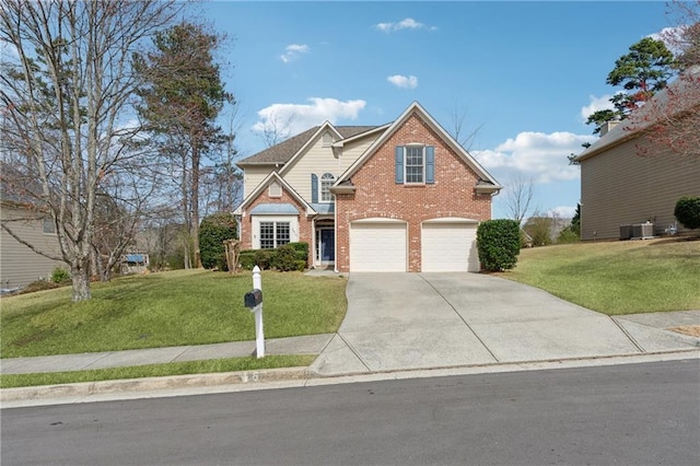 traditional-style house with a front lawn, driveway, central AC, a garage, and brick siding