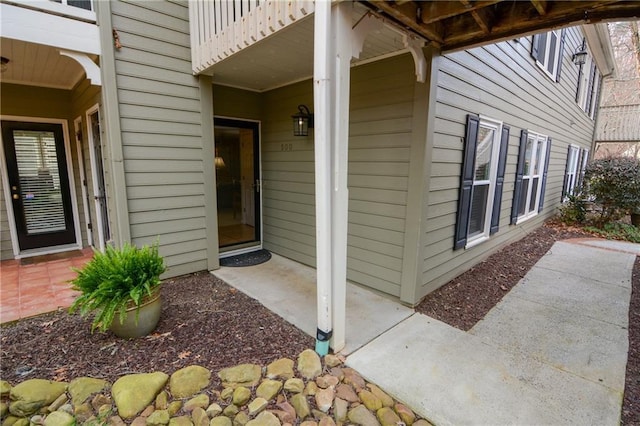 property entrance featuring a patio area