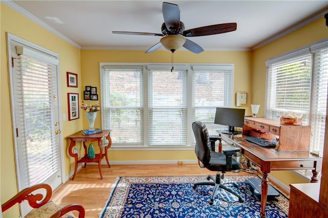 office featuring baseboards, wood finished floors, ceiling fan, and crown molding