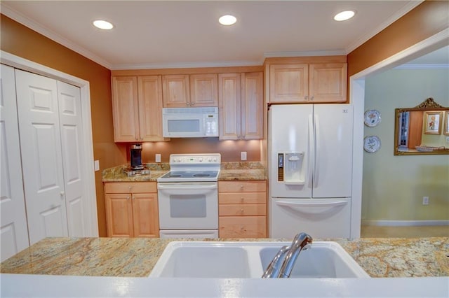 kitchen with a sink, white appliances, ornamental molding, and light brown cabinetry