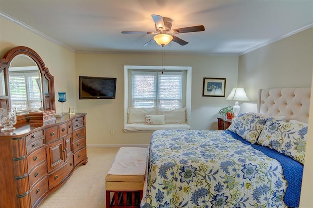 bedroom featuring crown molding, a ceiling fan, baseboards, and light carpet