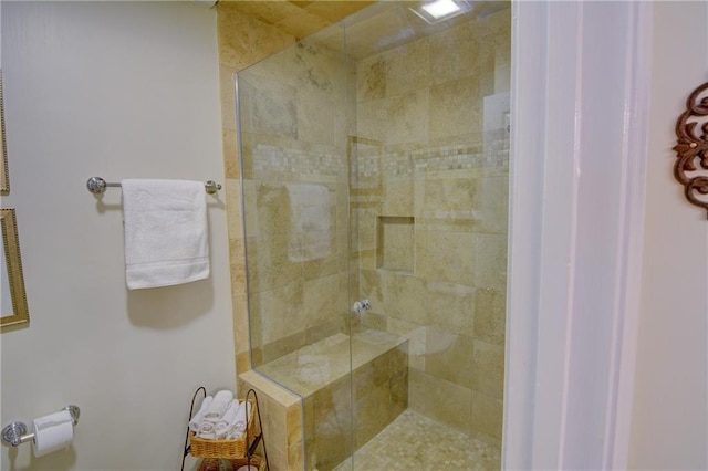 full bath with tiled shower