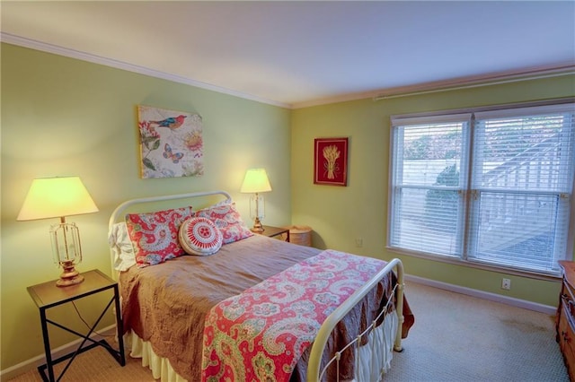 carpeted bedroom with baseboards and ornamental molding