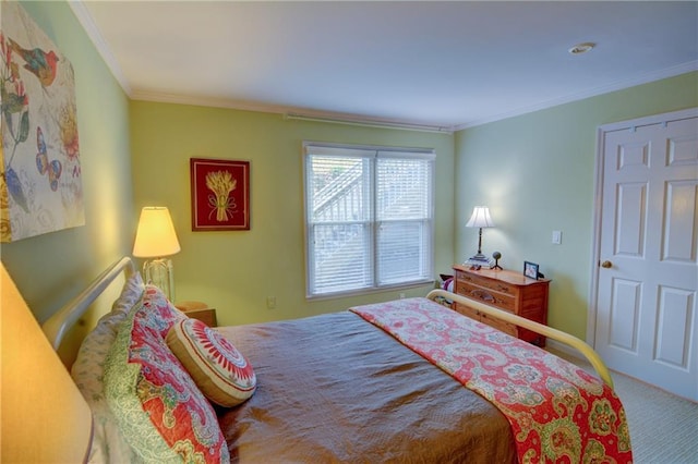 bedroom featuring ornamental molding and carpet flooring