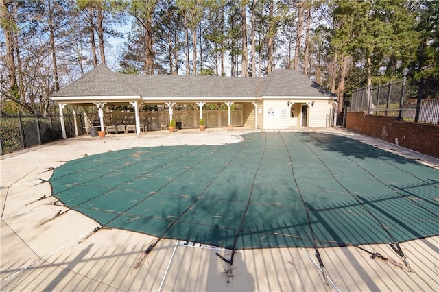 pool featuring a patio area and fence