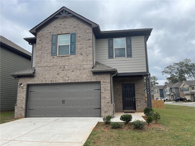 view of property featuring a front yard and a garage