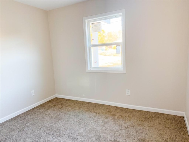 unfurnished room with carpet floors