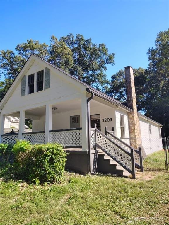 2203 Hillcrest Ave, Decatur, GA 30032 - view of property exterior with a yard and covered porch