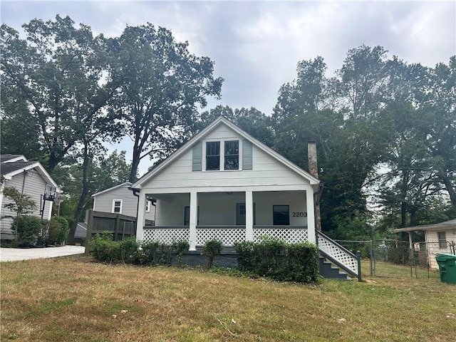 2203 Hillcrest Ave, Decatur, GA 30032 - bungalow-style house with a porch and a front lawn