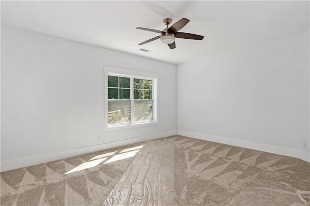 carpeted empty room with ceiling fan