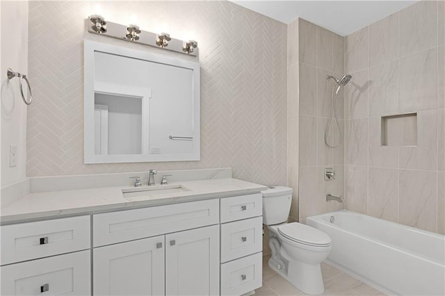 full bathroom with vanity, toilet, tiled shower / bath combo, and tile patterned floors