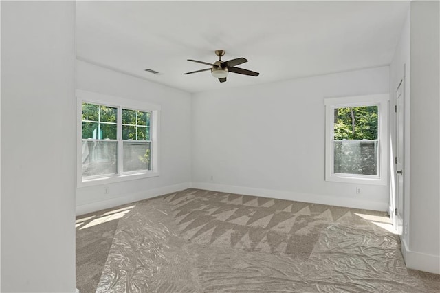 carpeted empty room with ceiling fan