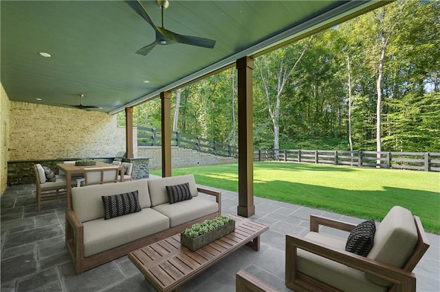 view of patio featuring an outdoor living space and ceiling fan