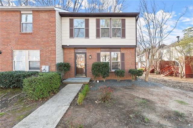 view of front of property featuring brick siding