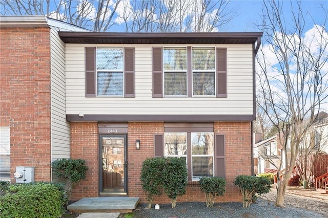 view of front of house with brick siding