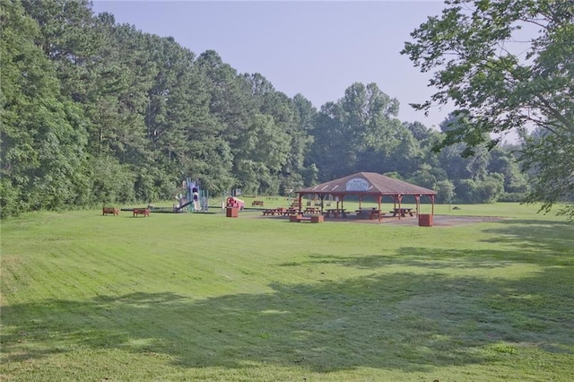 view of property's community with a yard and a gazebo