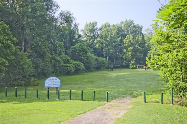 view of home's community with a lawn