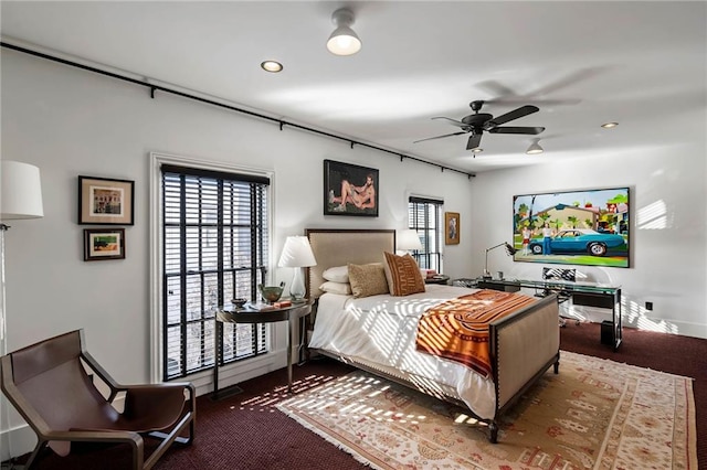 bedroom with ceiling fan and carpet