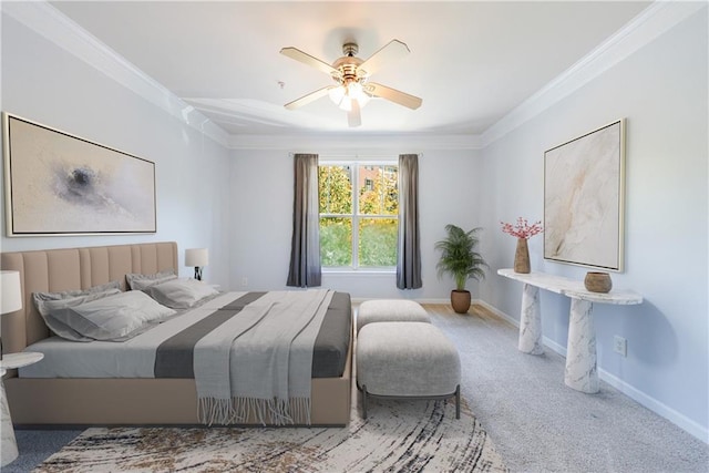 bedroom with carpet flooring, ceiling fan, and crown molding