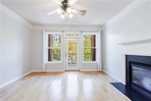 interior space with ceiling fan, a healthy amount of sunlight, and light hardwood / wood-style floors