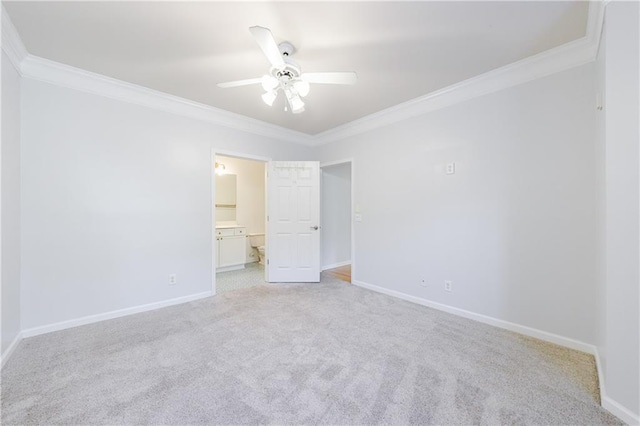 unfurnished bedroom with light carpet, connected bathroom, ceiling fan, and ornamental molding