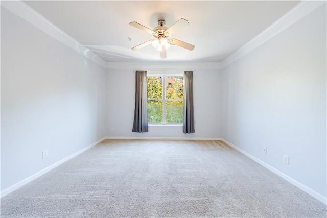 unfurnished room featuring carpet flooring, crown molding, and ceiling fan