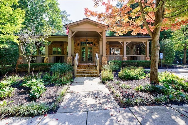 view of front facade with french doors and a porch