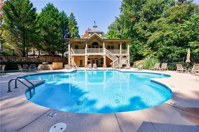 view of swimming pool featuring a patio