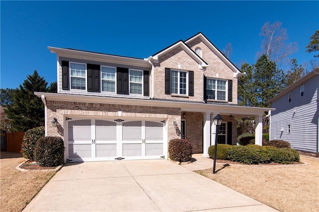 view of front of house with driveway, brick siding, and an attached garage