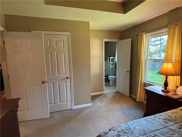 14 Green Gable Pt SW, Cartersville, GA 30120 - bedroom with light carpet, a textured ceiling, and connected bathroom