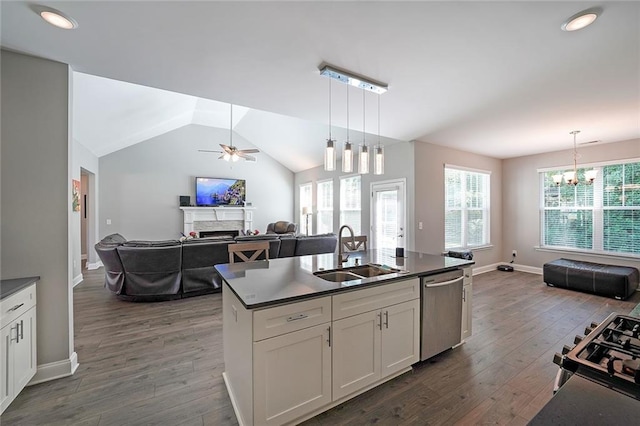 686 Stark St, Lawrenceville, GA 30046 - kitchen with a sink, dishwasher, a fireplace, dark countertops, and open floor plan