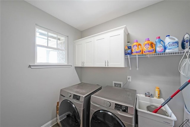 686 Stark St, Lawrenceville, GA 30046 - washroom with separate washer and dryer, cabinet space, and baseboards