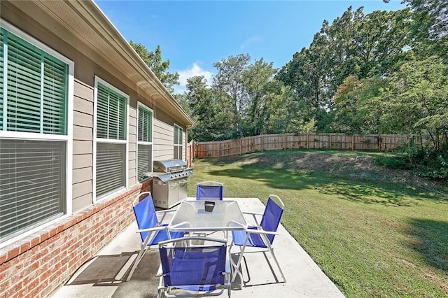 686 Stark St, Lawrenceville, GA 30046 - view of patio with grilling area, outdoor dining area, and view of wooded area