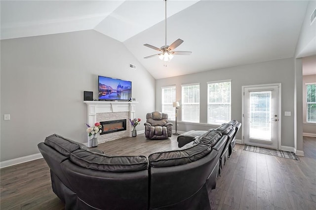 686 Stark St, Lawrenceville, GA 30046 - living room featuring lofted ceiling, a ceiling fan, a glass covered fireplace, wood finished floors, and baseboards