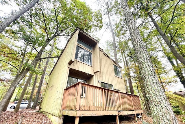 rear view of house with a wooden deck